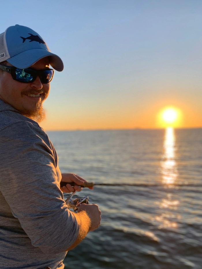 Vinny Baggio fishing at sunset – owner of Vincent Baggio Handyman Services